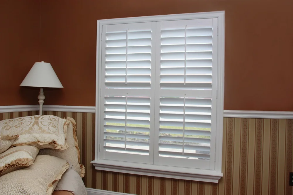 Custom plantation shutters in a sunlit sitting room