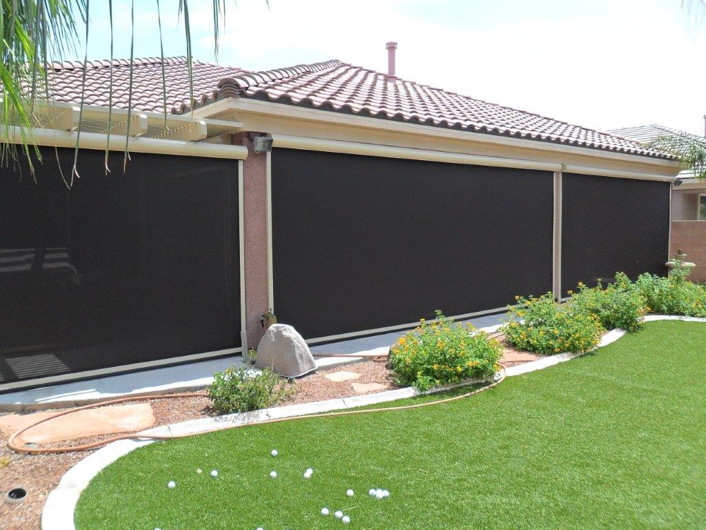 House with outdoor blackout window screens