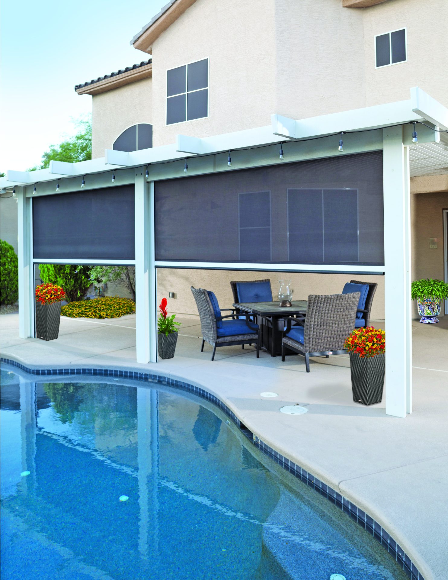 Patio with retractable shades and outdoor furniture